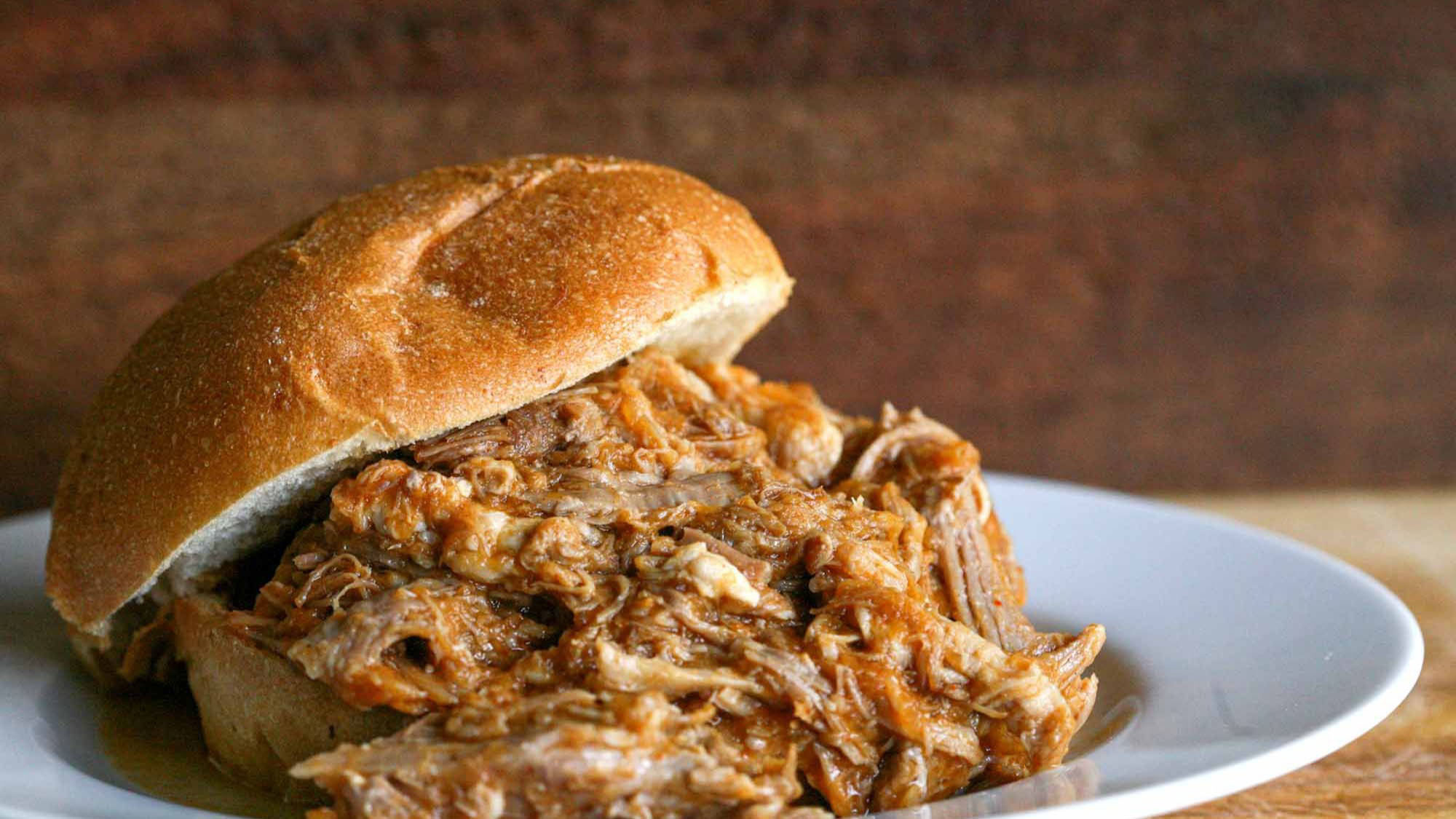 Pulled pork is an American barbecue dish, more specifically a dish of the Southern U.S., based on shredded barbecued pork shoulder. It is typically sl...